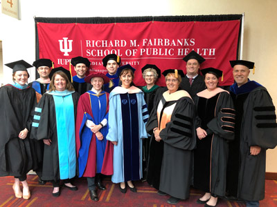 graduates and faculty posing