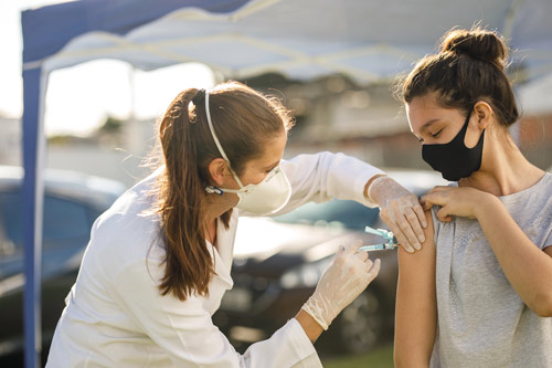 health care worker giving patient vaccination